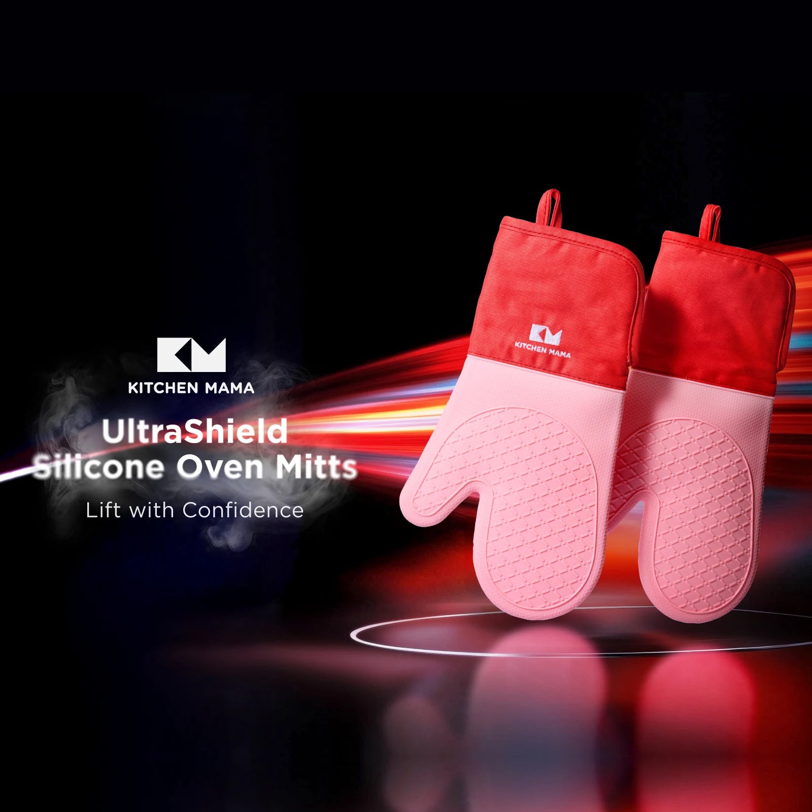 Two red and pink Shopkitchenmama silicone oven mitts displayed on a dramatic black background with dynamic lighting effects. Text overlay reads: "Oven Mitts – Lift with Confidence" alongside the Shopkitchenmama logo.